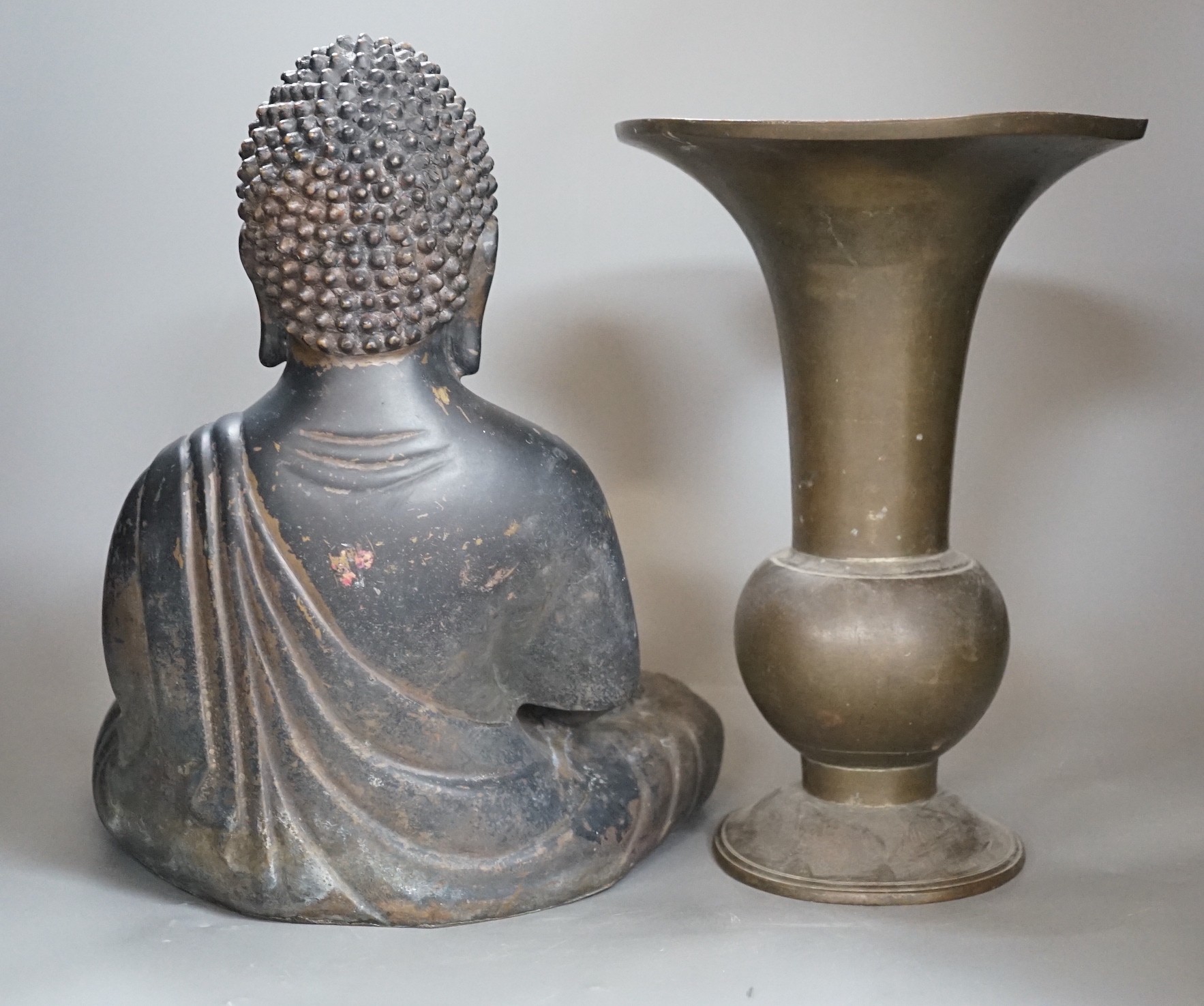 A Chinese bronze seated Buddha and a similar gu vase, tallest 30cm